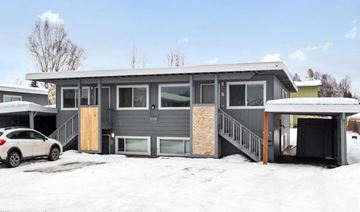 Anchorage apartment for rent - a home with a car garage in the snow