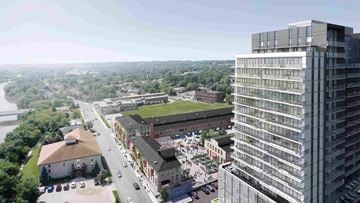 Cambridge apartment for rent - an aerial view of a city with tall buildings and a green field