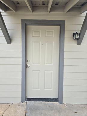 Bay City apartment for rent - A white door with a grey frame is closed.
