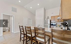 Fort Wayne apartment for rent - A kitchen with a table and chairs in the foreground.