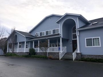 Monroe apartment for rent - A blue house with a white porch and a black door.