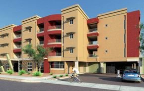 Phoenix apartment for rent - a person riding a bike in front of an apartment building