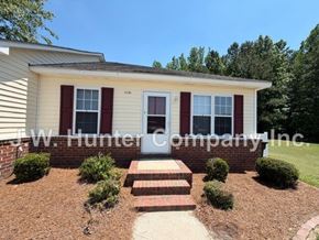 Wilson apartment for rent - A house with a red door and red shutters is for sale.