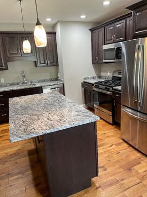 Rome apartment for rent - a kitchen with stainless steel appliances and granite counter tops