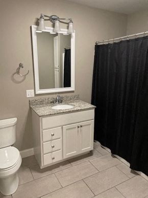 Rome apartment for rent - a bathroom with a toilet and a sink and a mirror