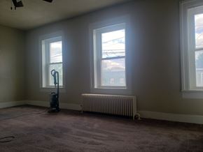 Rome apartment for rent - A room with a vacuum cleaner and a radiator.