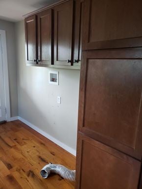 Rome apartment for rent - A room with wooden floors and a white wall with a switch.