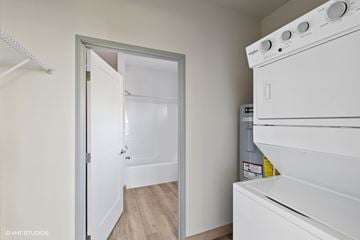 Whitefish apartment for rent - A white oven is in a kitchen with a white door.