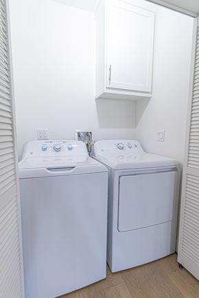 Inglewood apartment for rent - Two white front loading washing machines in a small laundry room.