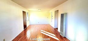 San Jose apartment for rent - an empty living room with white walls and wood floors