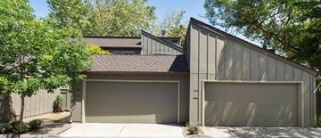 Los Gatos house for rent - a house with two garage doors and a driveway