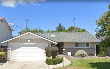 Santa Clara house for rent - a white house with a white garage door