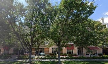 Cupertino house for rent - a building with trees in front of it