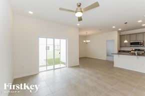 Bartow house for rent - a kitchen and living room with a ceiling fan