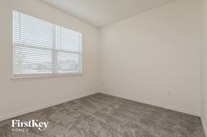 Bartow house for rent - a bedroom with a carpeted floor and a window