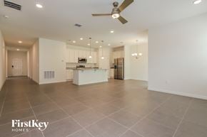 Bartow house for rent - an open kitchen and living room with a ceiling fan
