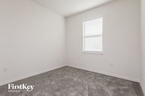 Bartow house for rent - the living room of a home with white walls and a window