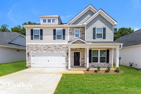 Greenville house for rent - A two-story house with a garage is for sale.