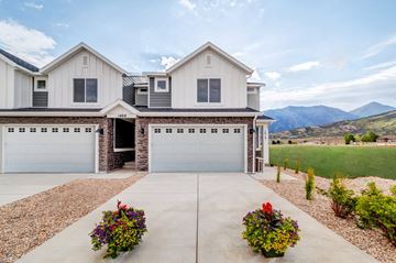 Santaquin house for rent - the front of a house with a garage and a driveway