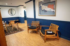 Hoboken apartment for rent - A room with two chairs and a painting on the wall.