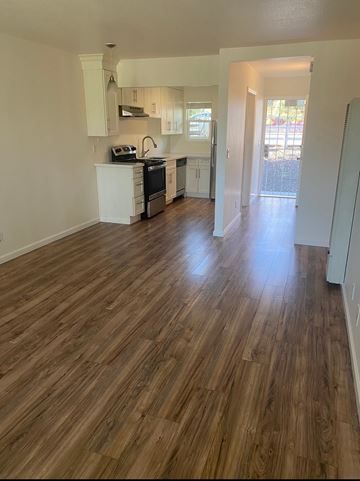 Vallejo apartment for rent - A kitchen with wooden floors and white walls.