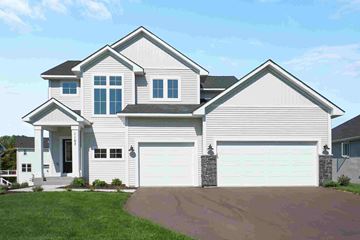 New Richmond house for rent - a white house with a garage and a driveway