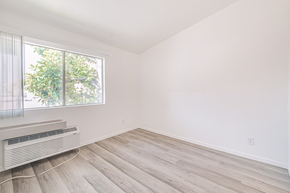 Rialto multi-family for rent - A room with a window and a heater.