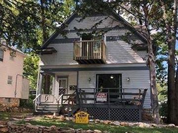 Lawrence apartment for rent - A house with a sign that says "For Sale".