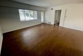 Los Angeles apartment for rent - an empty living room with wood floors and a window