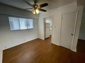 Los Angeles apartment for rent - a bedroom with a ceiling fan and a door to a closet