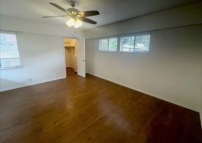 Los Angeles apartment for rent - an empty living room with wood floors and a ceiling fan