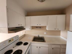 Vallejo apartment for rent - A kitchen with white appliances and cabinets.