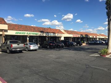 Cypress apartment for rent - A parking lot in front of a store with the name "Advance Electronics".