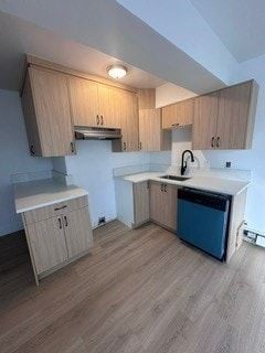 Calgary apartment for rent - A kitchen with wooden cabinets and a blue dishwasher.