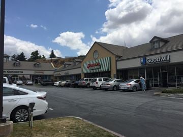 Yucaipa apartment for rent - a parking lot full of cars in front of a grocery store