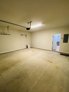 Lafayette house for rent - A room with a white wall and a door on the right side.