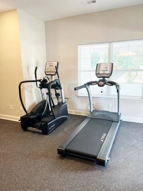 Greenville apartment for rent - two exercise machines in an empty gym room