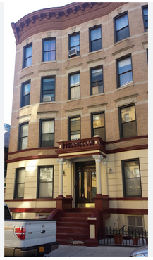 Brooklyn apartment for rent - the front of a building with a truck parked in front of it