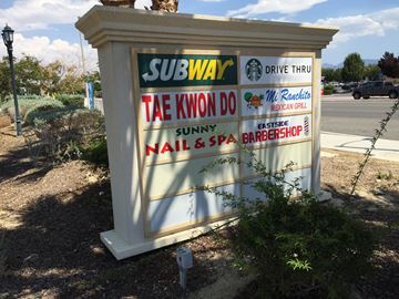 Palmdale apartment for rent - the sign for subway drive thru on the side of the road