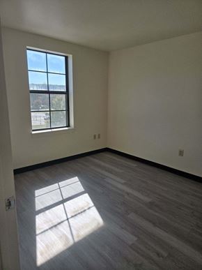 Coatesville apartment for rent - the living room of an empty house with a window