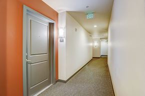Seattle apartment for rent - a hallway with a door and a exit sign