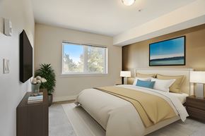 Seattle apartment for rent - a bedroom with a bed and a tv