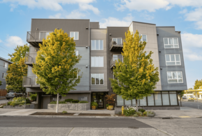Seattle apartment for rent - A modern apartment building with trees in front.