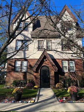 Rockville Centre apartment for rent - A large house with a black door and windows.