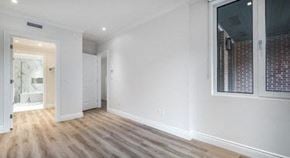 Westmount apartment for rent - a living room with white walls and wooden floors