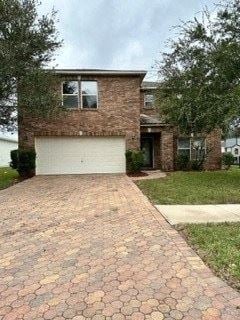 Jacksonville house for rent - A brick house with a white garage door.