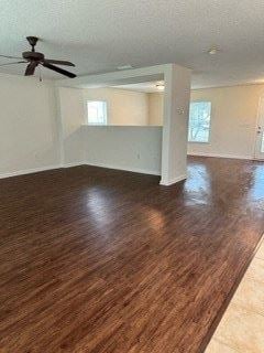 Jacksonville house for rent - A room with a ceiling fan and wooden flooring.