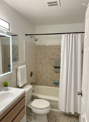 Cincinnati apartment for rent - A white toilet sits next to a sink in a small bathroom.