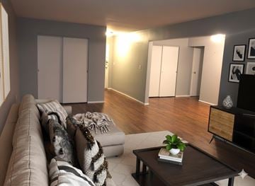 Cincinnati apartment for rent - A living room with a brown couch and a coffee table.