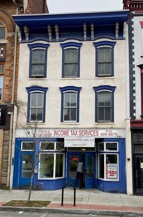Coatesville apartment for rent - A blue and white building with a sign for Gorilla Associates Income Tax Services.